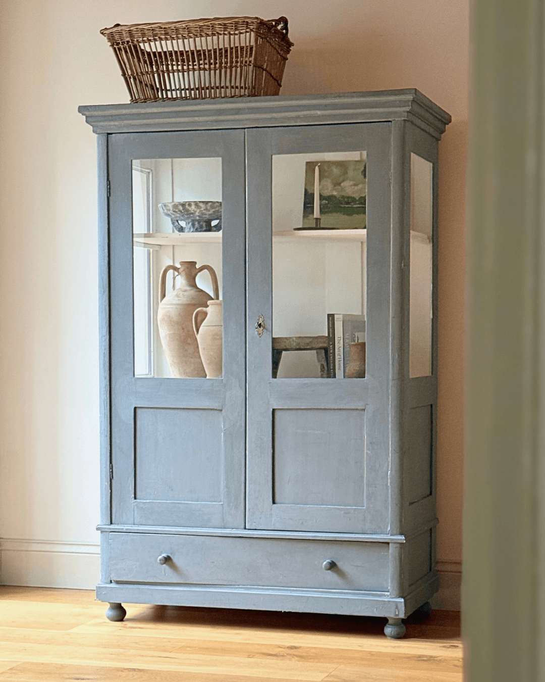 Antique victorian display cabinet with glazed glass doors and soft blue painted finish. Ideal as a linen, pantry or decorative display cupboard.