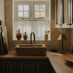 Wide view of a country kitchen with a stone sink, the Raffles rechargeable lamp at the end of the worktop