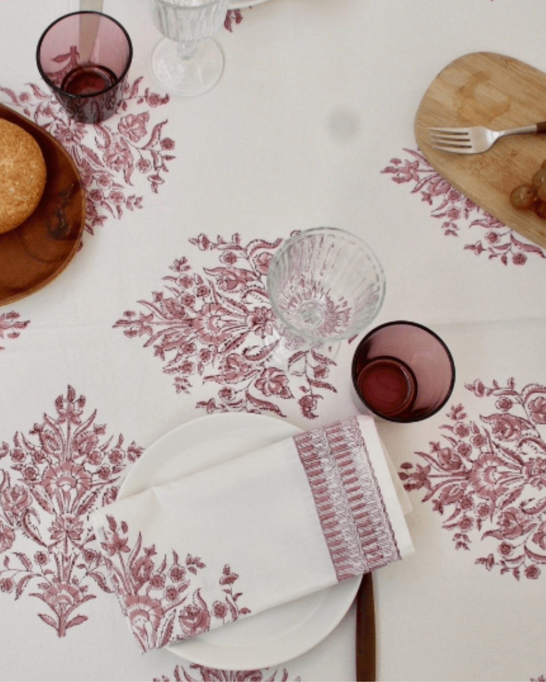 white table cloth with pink floral pattern block printed on fair trade cotton