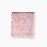 hand printed muted pink tablecloth foliage coastal pattern surrounded by a stripe border