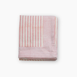 pink and white block print tablelcoth
