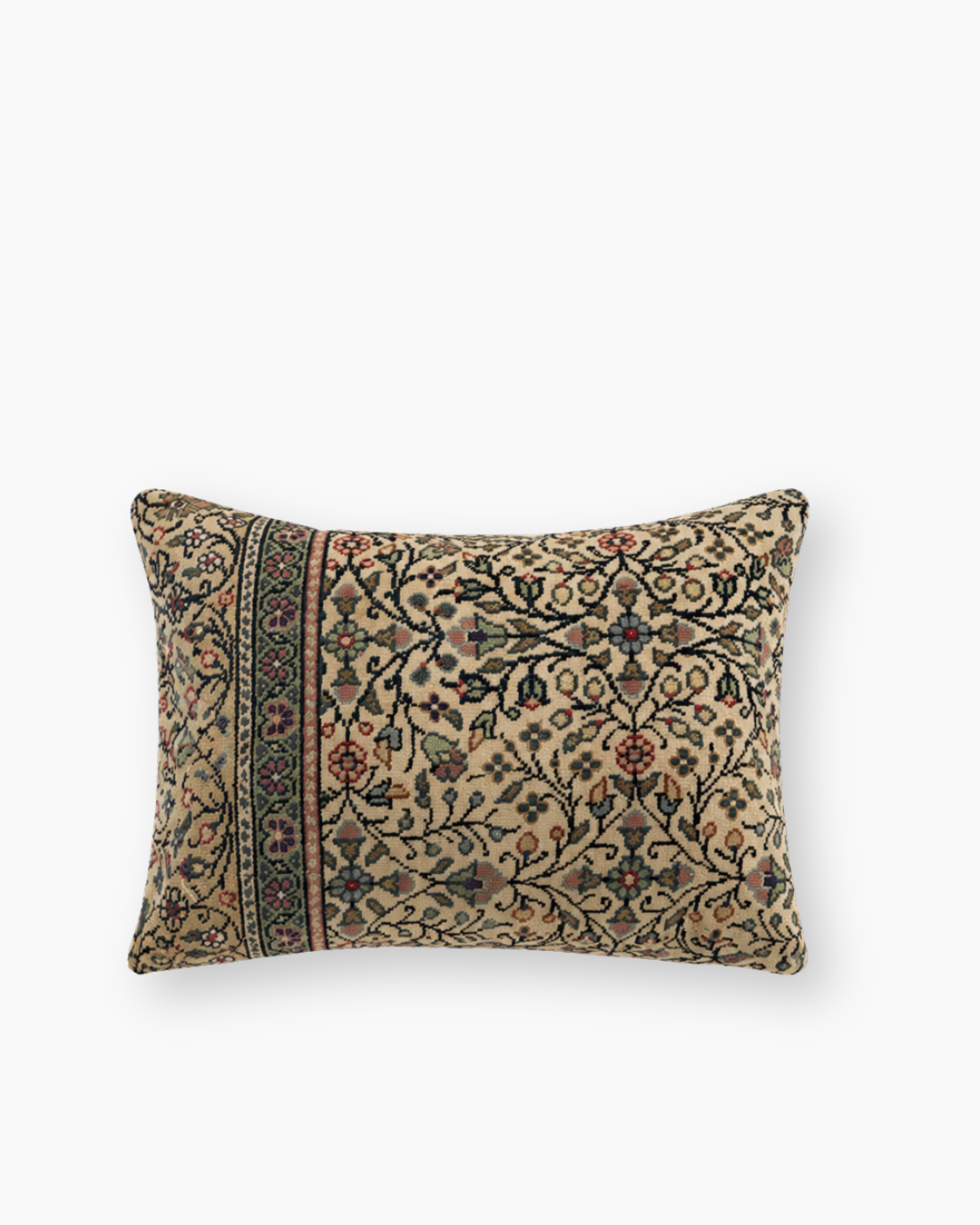 vintage kilim bolster cushion cover in greens and reds on a cream background
